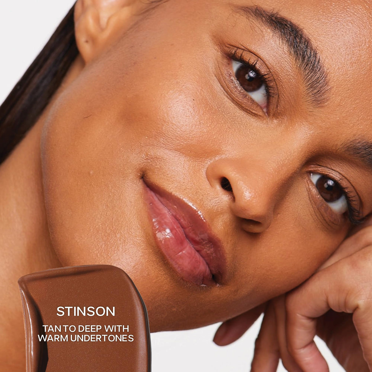 Saie Dew Bronze on-cheek application showing sun-kissed glow with soft, blendable finish.