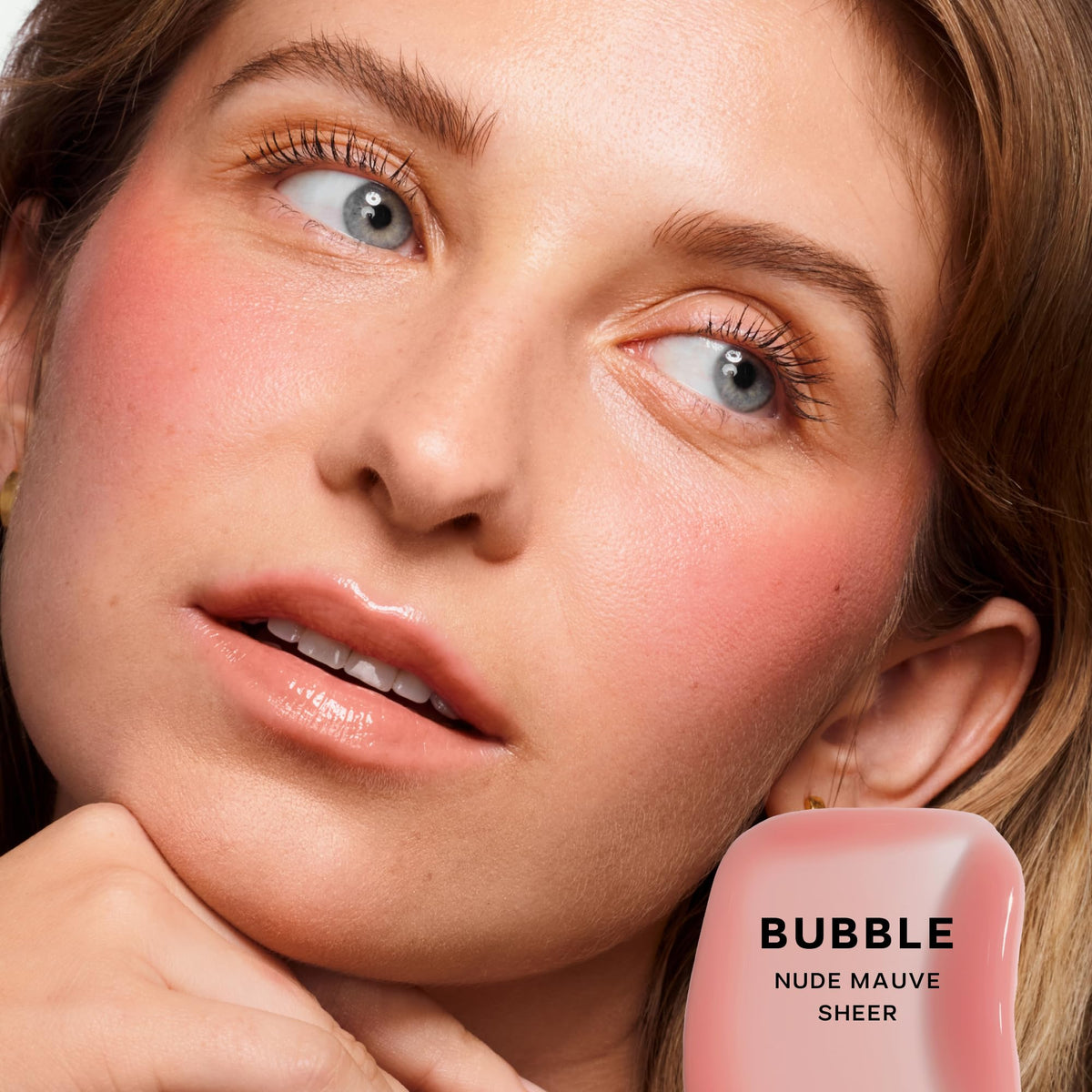 Saie Glossybounce high-shine gloss on lips with cushiony feel and hydration