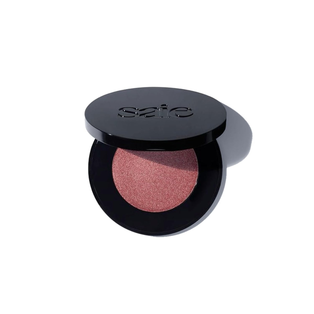 Saie Glow Sculpt compact on display for on-the-go highlighter and blush.