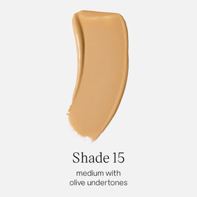 Saie Glowy Super Skin Tint bottle side view highlighting olive undertones for balanced skin tone