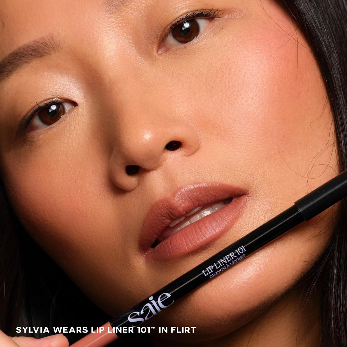 Saie Lip Liner 101 lip swatch demonstrates natural definition and comfortable wear.