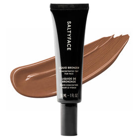 SALTYFACE Liquid Bronzer bottle pour creates a natural bronze glow.