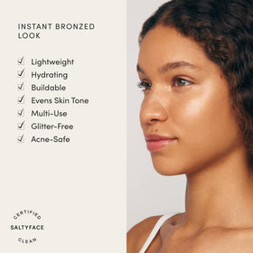 SALTYFACE Liquid Bronzer swatch on cheek shows warm, even bronze.