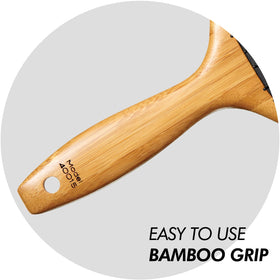 Sam Villa Bamboo Brush detangles extensions without pulling.