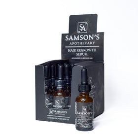 Samson's Apothecary hair regrowth serum bottle on a clean surface for daily scalp nourishment.