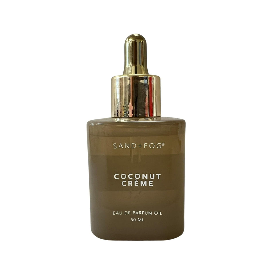 Sand + Fog Coconut Creme Eau De Parfum Oil bottle, ideal for subtle, long-lasting coconut scent.