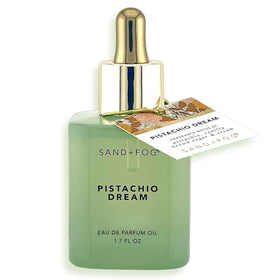 Sand + Fog Pistachio Dream oil bottle with mint glass shows premium packaging and long-lasting scent.