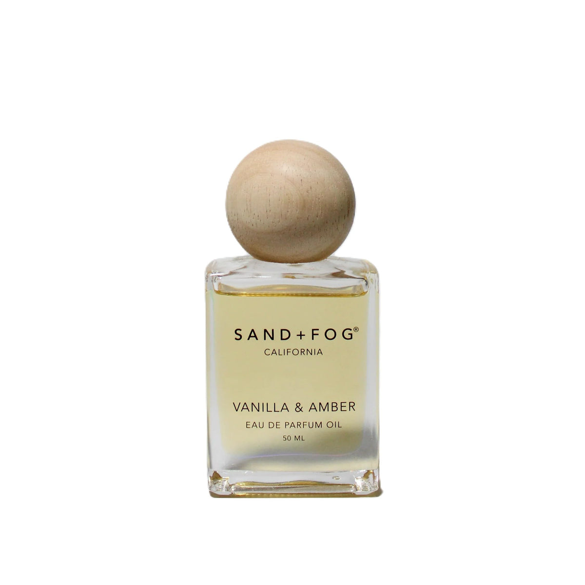 Sand + Fog Vanilla and Amber perfume oil bottle with roll-on for precise scent application.