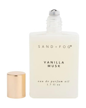 Sand + Fog Vanilla Musk roll-on being applied to pulse points for a personal aroma