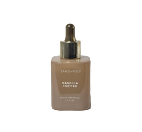 Sand + Fog Vanilla Toffee perfume oil bottle on vanity, ideal for daily wear.
