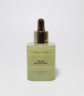 Sand + Fog Pear Blossom dropper oil swatch on skin, showcasing lasting fragrance