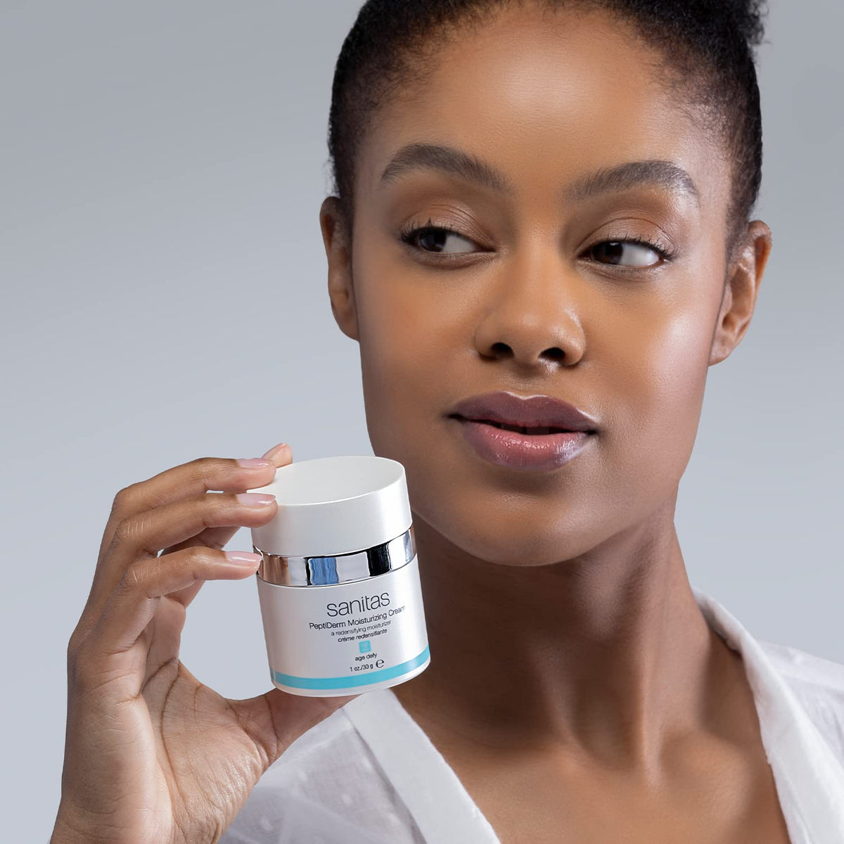 Sanitas PeptiDerm vitamin C jar reveals brightening components for healthy glow.