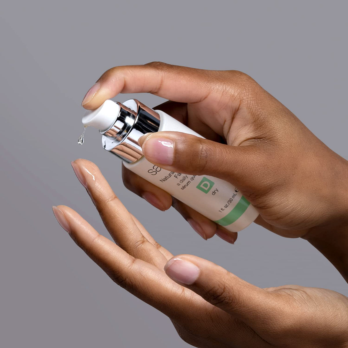Sanitas Natural Moisture Factor serum being poured for quick absorption
