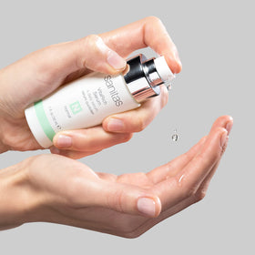 Sanitas VitaRich Serum application pump close-up suggests easy, precise dosing for daily use.