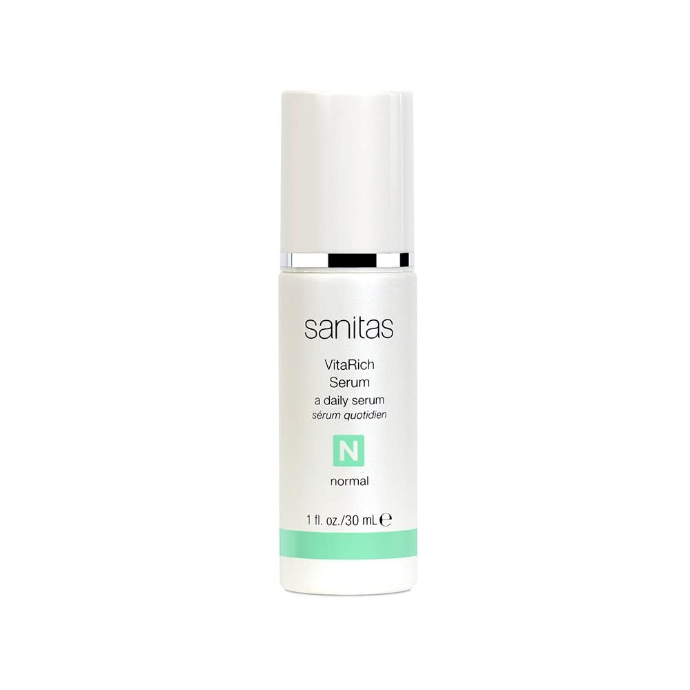 Sanitas VitaRich Serum bottle pour demonstrates hydrating, antioxidant-rich care for radiant skin.