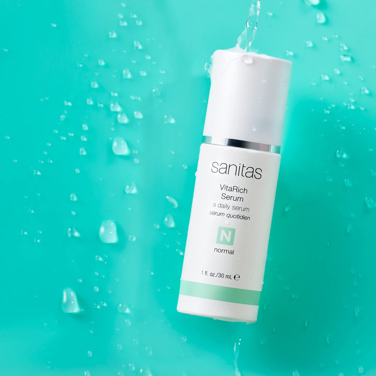 Sanitas VitaRich Serum texture swirl highlights nourishing vitamins for a brighter complexion.