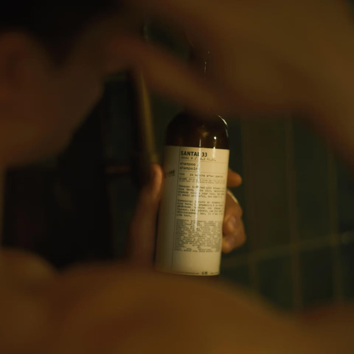 Santal 33 shampoo for color-treated hair protection during washing.