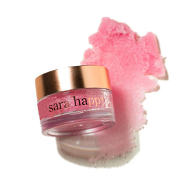 Close-up shows fine sugar crystals of Sara Happ lip scrub for gentle exfoliation.