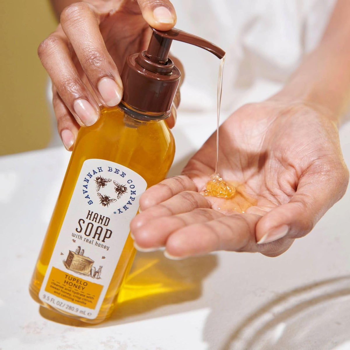 Savannah Bee Company hand soap pour shot emphasizes refreshing citrusy lemongrass and spearmint scent.