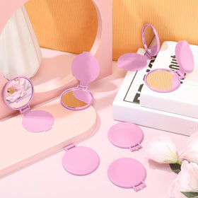 Saysurey pink travel-friendly mirror fits in a purse for daily use.