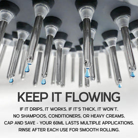Adult users comfortably applying oil with Scalp Direct massager