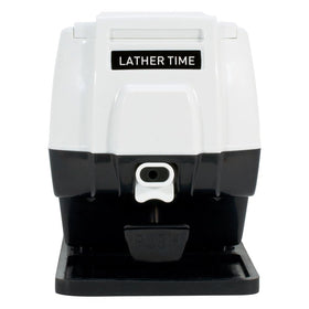 Close-up of the dispensing button on Scalpmaster Pro hot lather machine