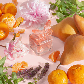 Dolly Parton Scent from Above pink bottle reflects feminine style.