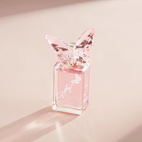 SCENT BEAUTY Dolly Parton lip gloss close-up, pink shine complements floral notes