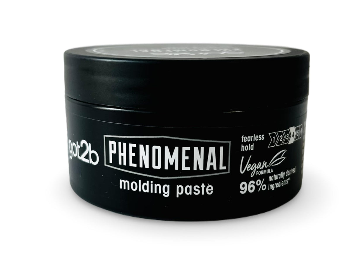 Hands applying Schwarzkopf got2b Phenomenal Moulding Paste for defined texture