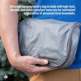 Sea to Summit hanging toiletry bag in spicy orange closed demonstrates compact packing