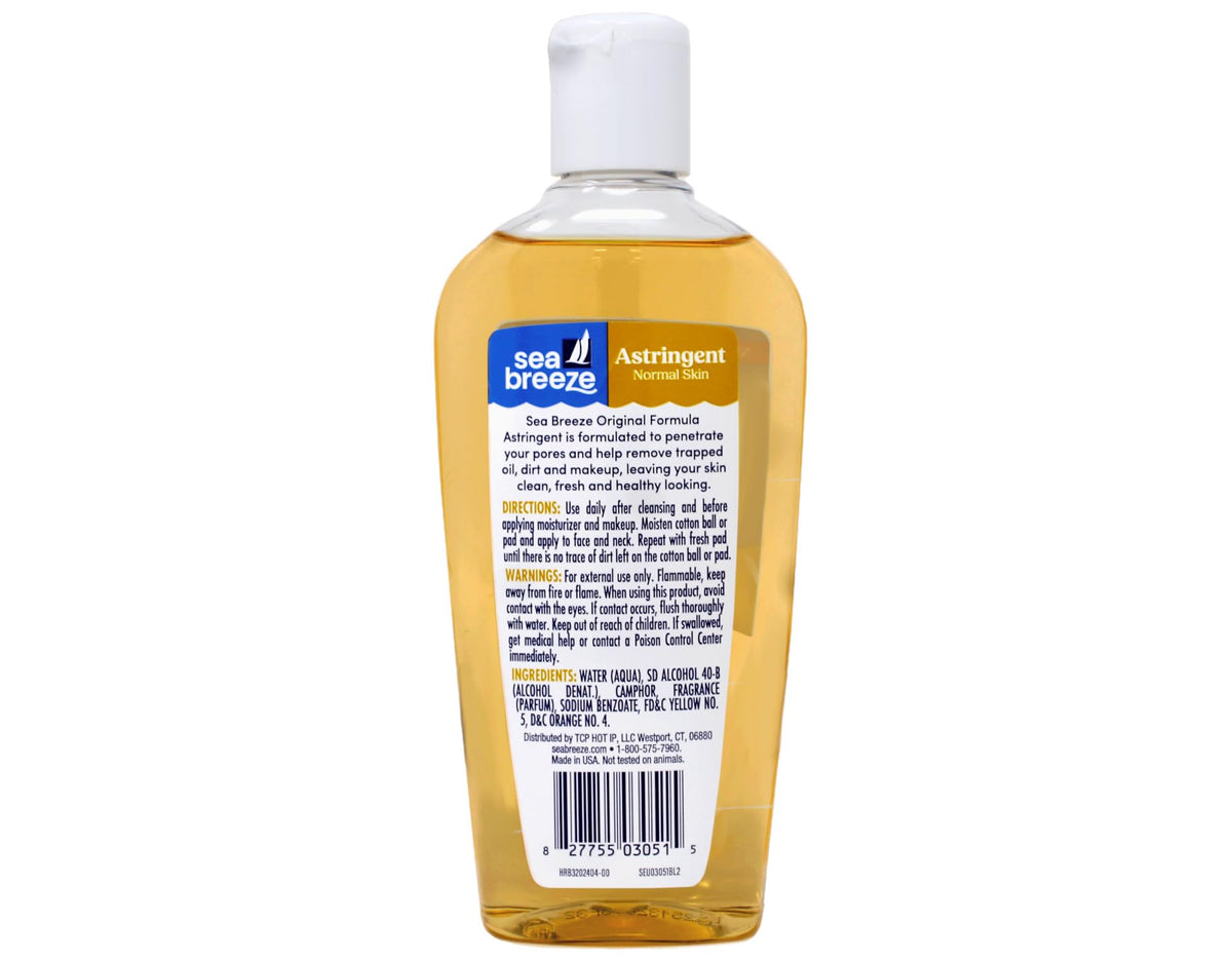 Seabreeze Astringent applied with cotton pad on face and neck for cleansing.