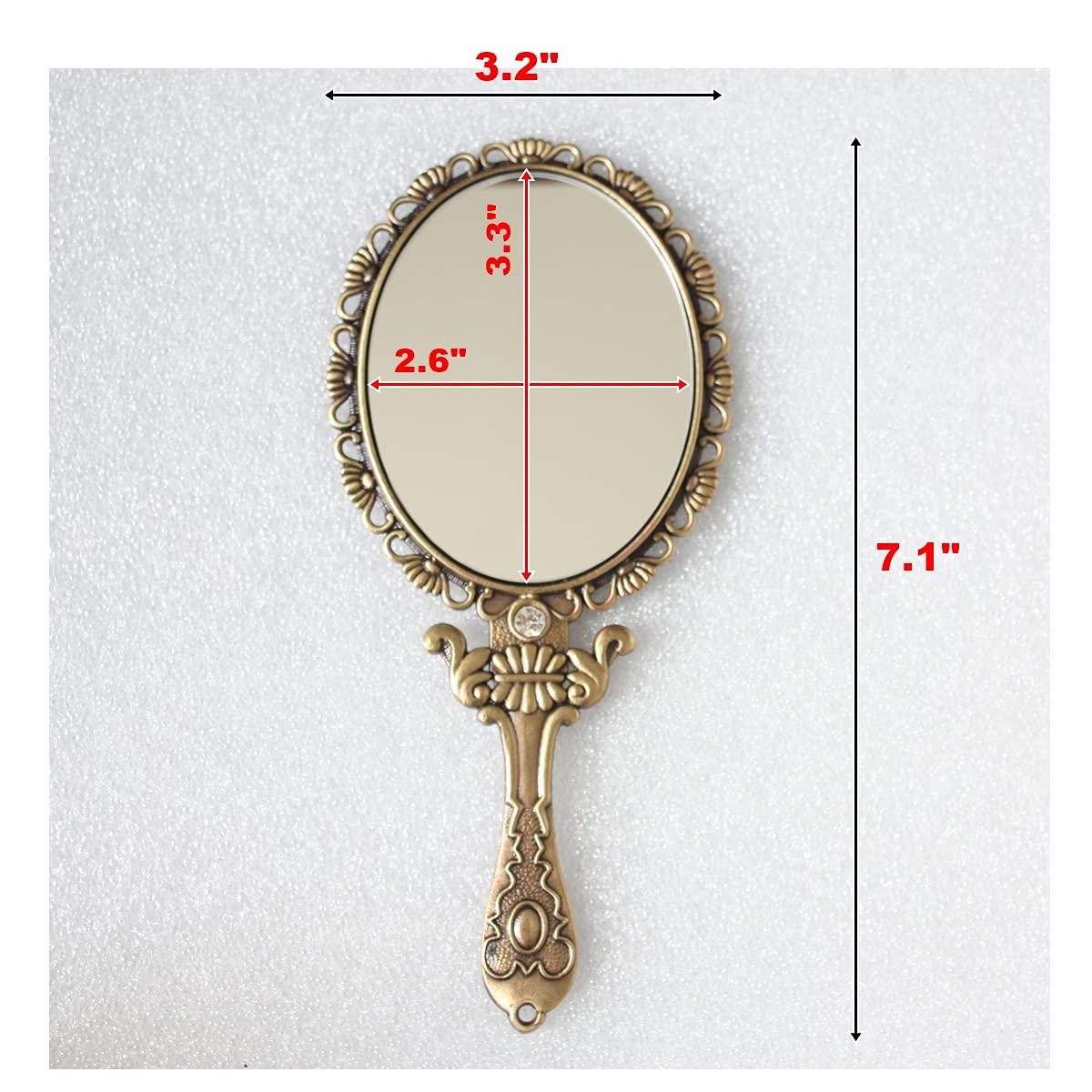 SEHAMANO hand mirror in matte gold brass features a slim, easy to hold profile.