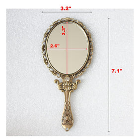 SEHAMANO hand mirror in matte gold brass features a slim, easy to hold profile.