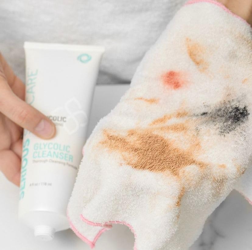 Rinsing action of Serious Skincare Glycolic Cleanser under water for clean feel