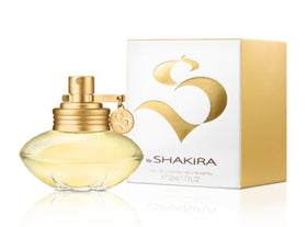 Shakira S perfume bottle close-up with blossoms evoking airy, fresh notes