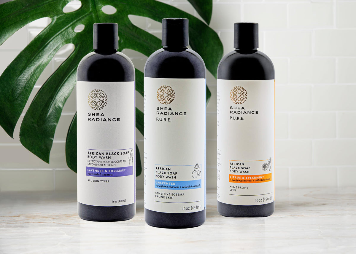 Bathroom scene featuring Shea Radiance African Black Soap Body Wash on shower shelf.