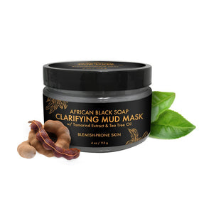 Applying SheaMoisture African Black Soap Mask on blemish-prone skin for deep cleanse.
