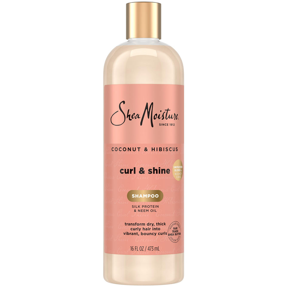 SheaMoisture Coconut & Hibiscus shampoo bottle demonstrates frizz control for defined curls