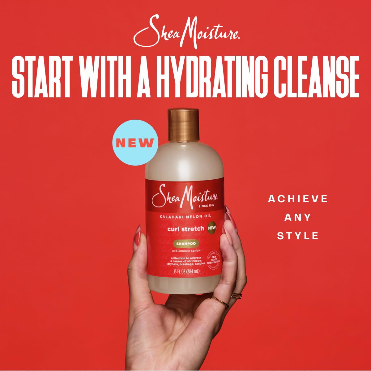 SheaMoisture Curl Stretch Refresher Spray bottle misting curls between washes.