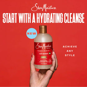 SheaMoisture Curl Stretch Refresher Spray bottle misting curls between washes.
