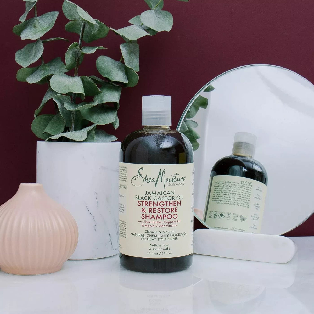 SheaMoisture four-pack bottles on shelf.