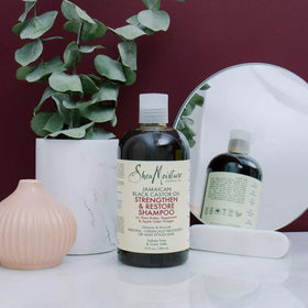 SheaMoisture four-pack bottles on shelf.