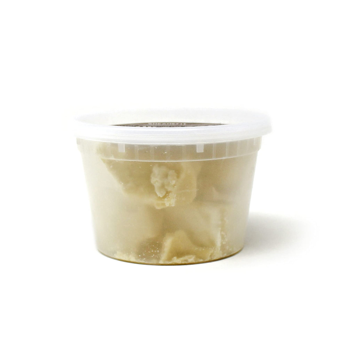 Sheanefit cocoa butter texture closeup highlights unrefined quality and creamy feel.