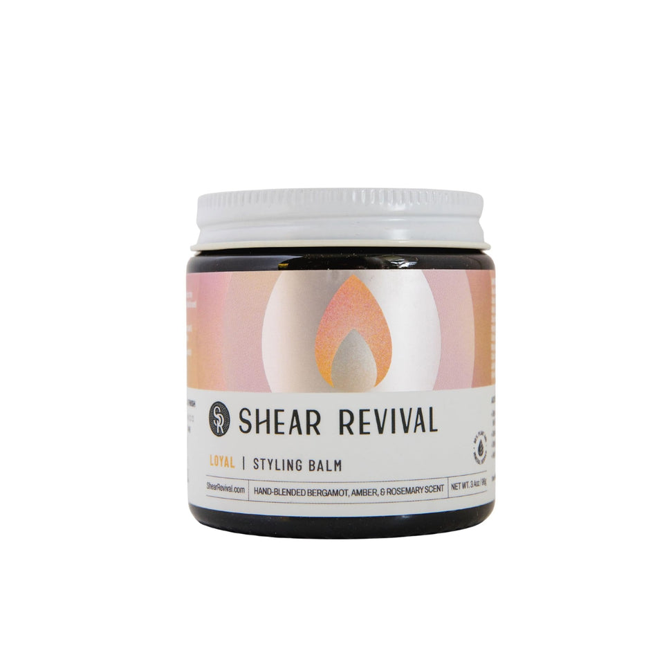 Shear Revival Loyal Styling Balm bottle close-up showing premium packaging and light hold.
