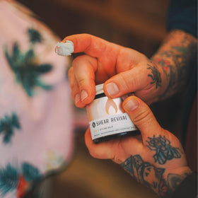 Travel-size Loyal Styling Balm in amber jar shows compact, eco-conscious packaging.