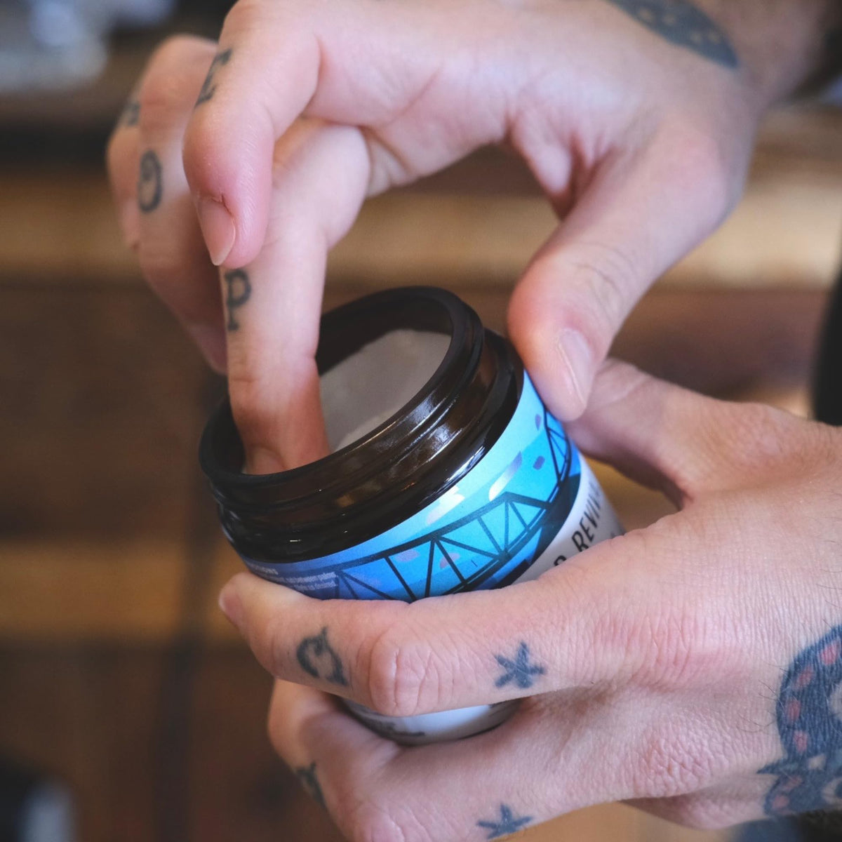 Amber glass jar underscores eco-conscious packaging and travel-friendly design.