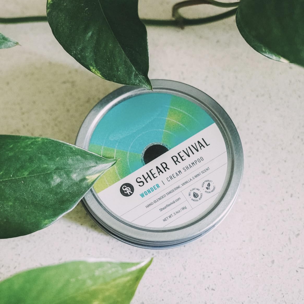 Shear Revival Wonder Shampoo travel tin packaging for on-the-go grooming.