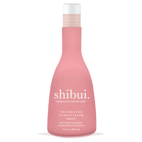 Shibui Volumizing Conditioner bottle pour showing weightless moisture for fine hair.