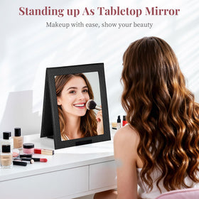 Shinowa mirror with sturdy handle ready to hang in hotel rooms or tents.