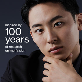 Shiseido Men Ultimune Serum during face application, smooths evenly for preparation.